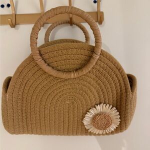 Elegant Tan Woven Handbag with Floral Accent